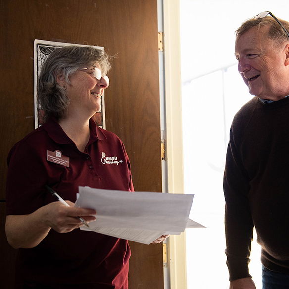 A health equity professional speaking to a client. 
