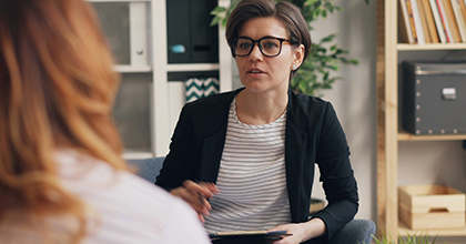 A social worker speaking with a client. 