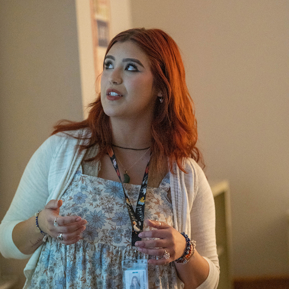 An Education student presenting in front of a classroom