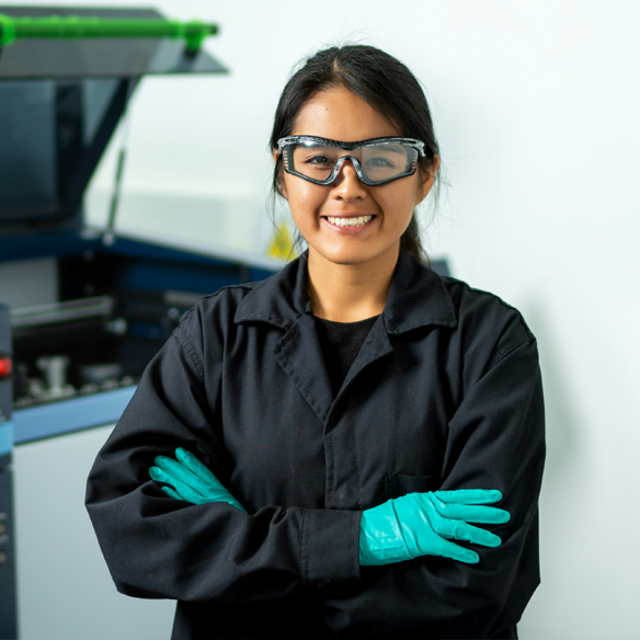 Woman standing in front equipment