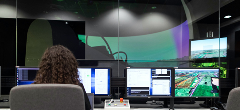 female aerospace engineer using flight simulator