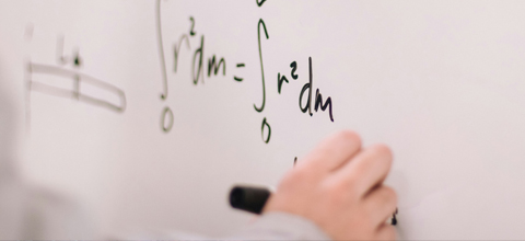 A algebra equation on a whiteboard