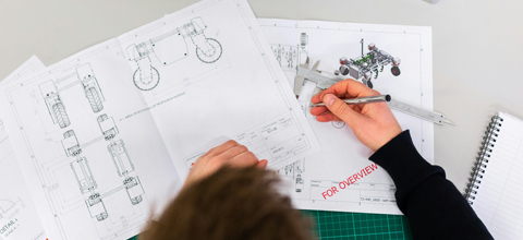 Male mechanical engineer designs agricultural robots