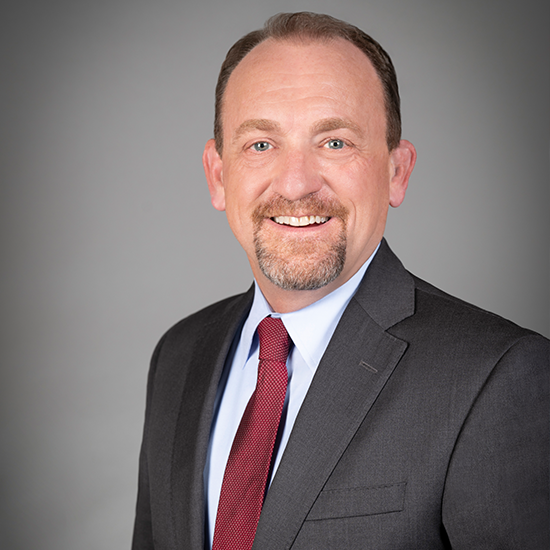 Gregg Hull wearing professional clothing.
